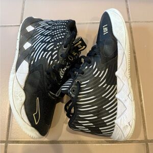 Melo Black and Gold Sneakers